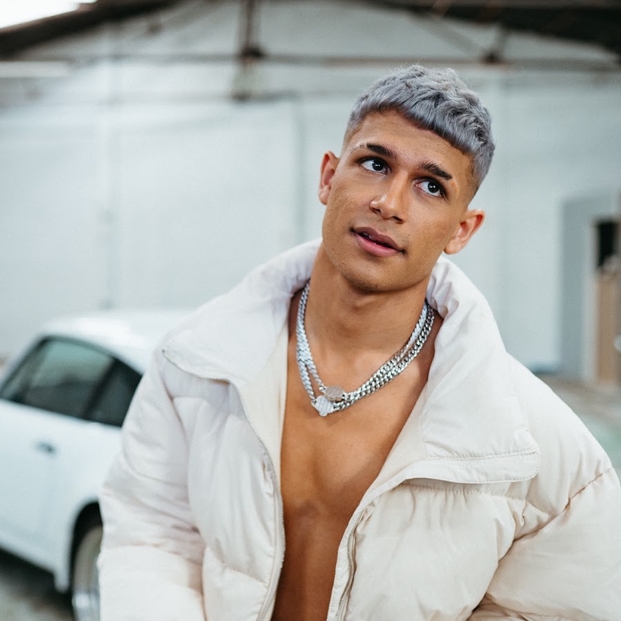 Man in puffer jacket with silver necklace